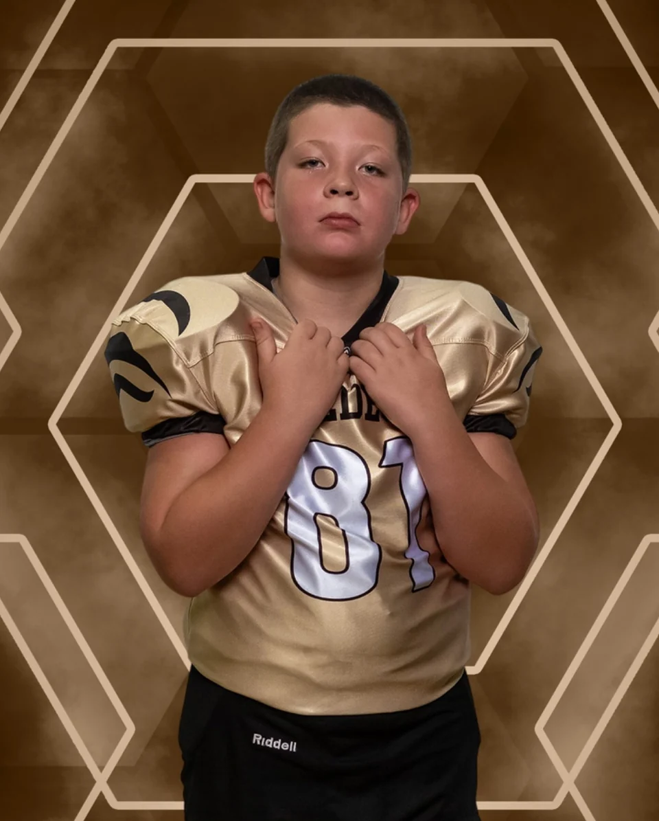 Charlie in his football uniform